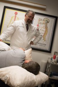 Chiropractor Glencoe MN Kurt Kramer with Patient
